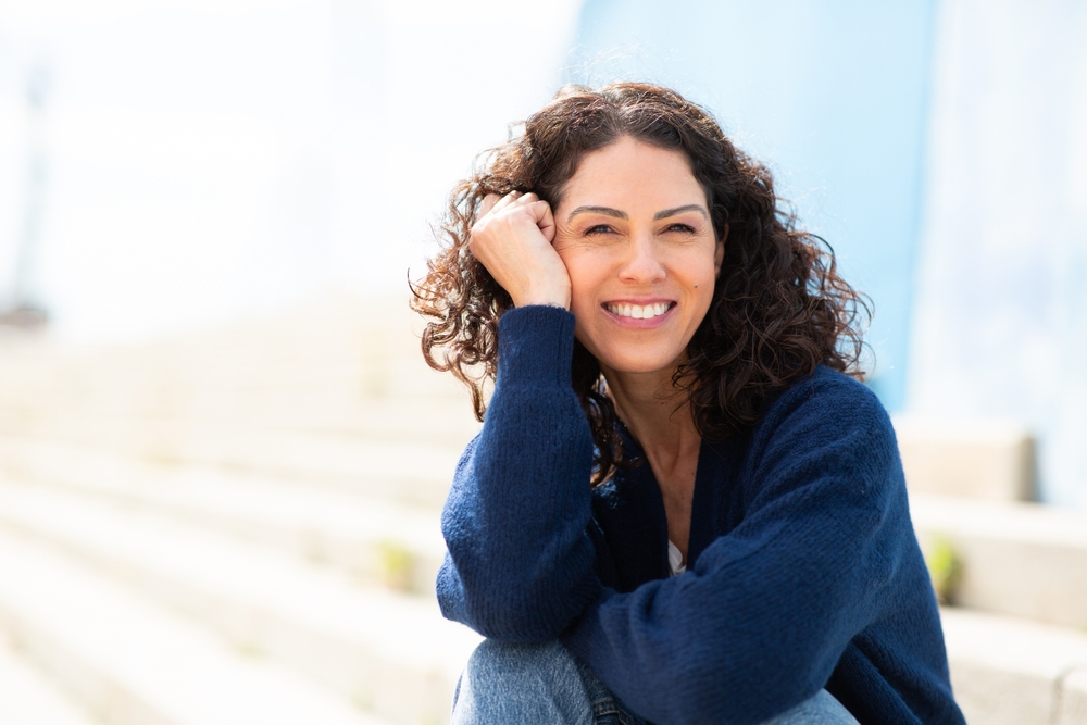 Woman smiling outdoors