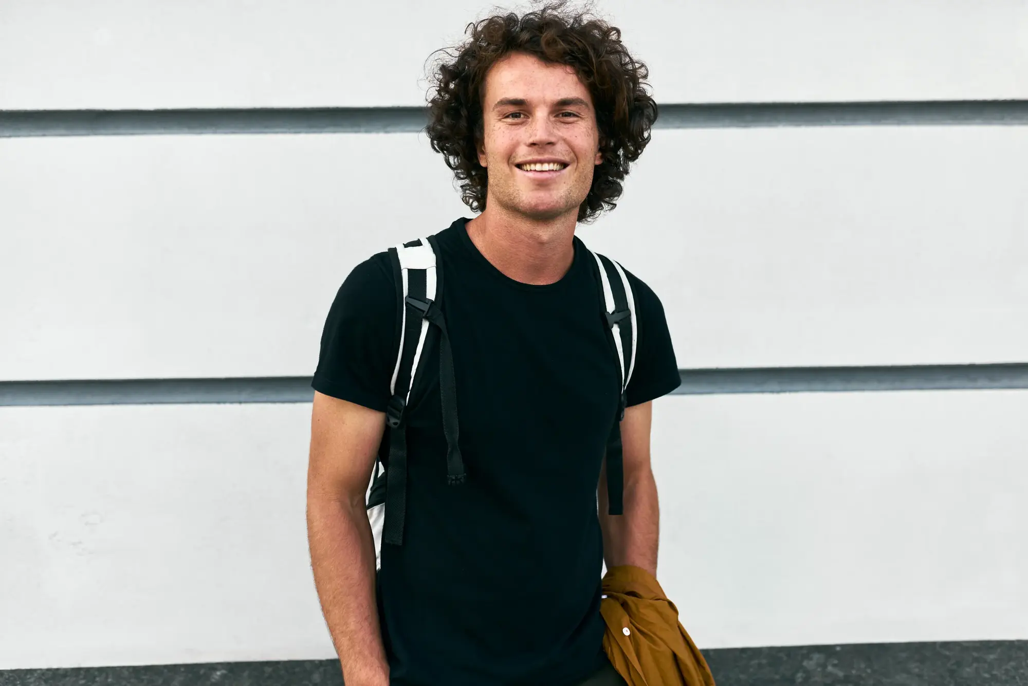 Young man smiling outdoors